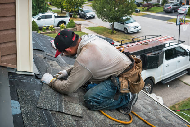 Professional Roofing technician working in West River, MD